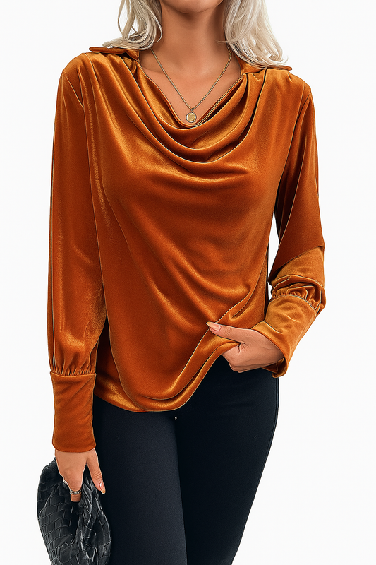 Woman wearing a vintage velvet elegant swing collar shirt in rich brown with long sleeves and subtle gathering at cuffs, paired with black pants.